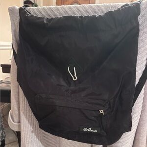 Black Club Wyndham waterproof backpack. 16” x 16” x 6” wide base.EUC